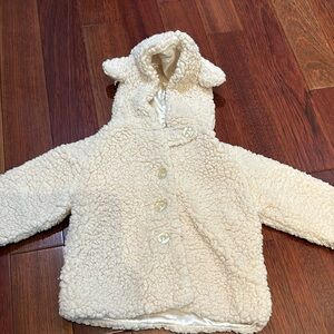 Cream coloured fluffy coat 12-24 months